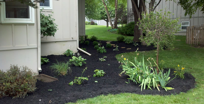 Bark Mulch Installation In Garden Beds